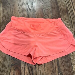 Coral lululemon shorts.  No size dot, but they are 4 reg.  In great condition